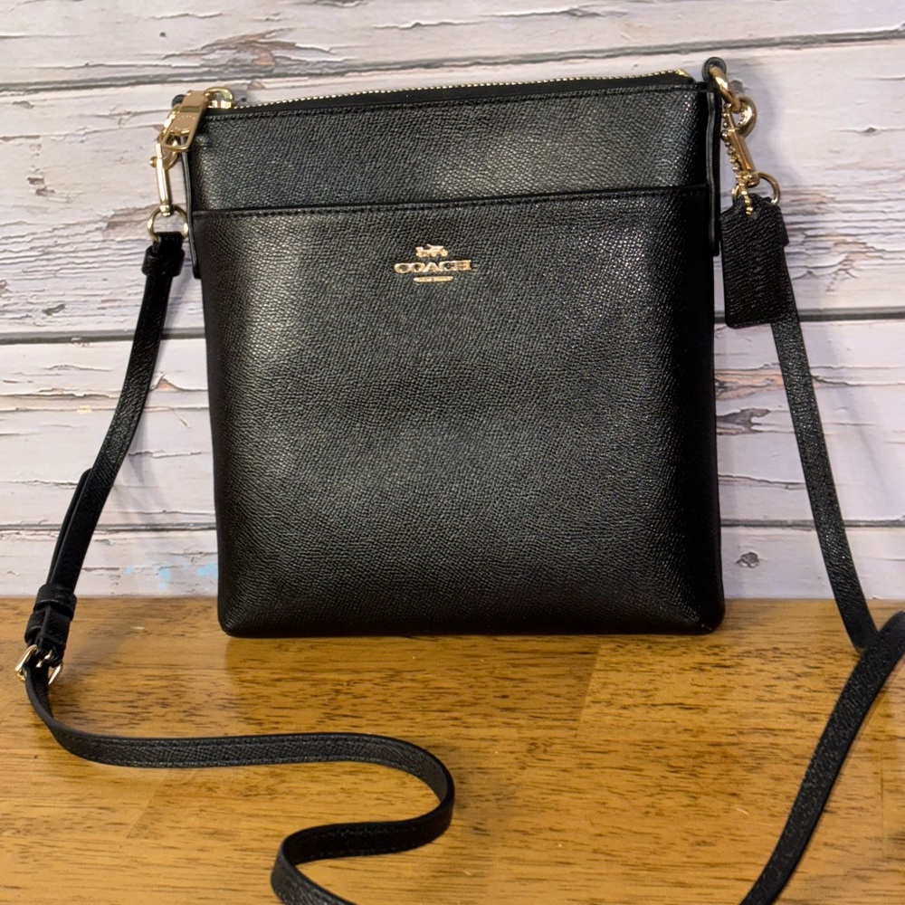 Coach Black Kitt messenger crossbody bag.